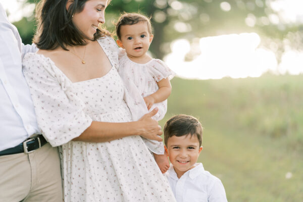 Mom and kids during an outdoor family session in Dallas Texas