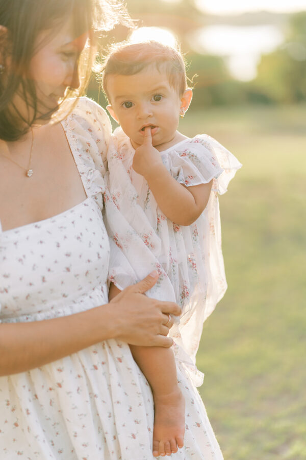 Hazy backlit motherhood picture during an outdoor photo session