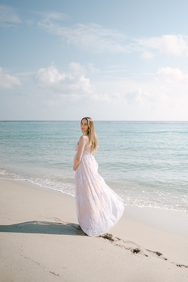 intimate beach maternity session photographed by Kamy Photographie in Miami, FL