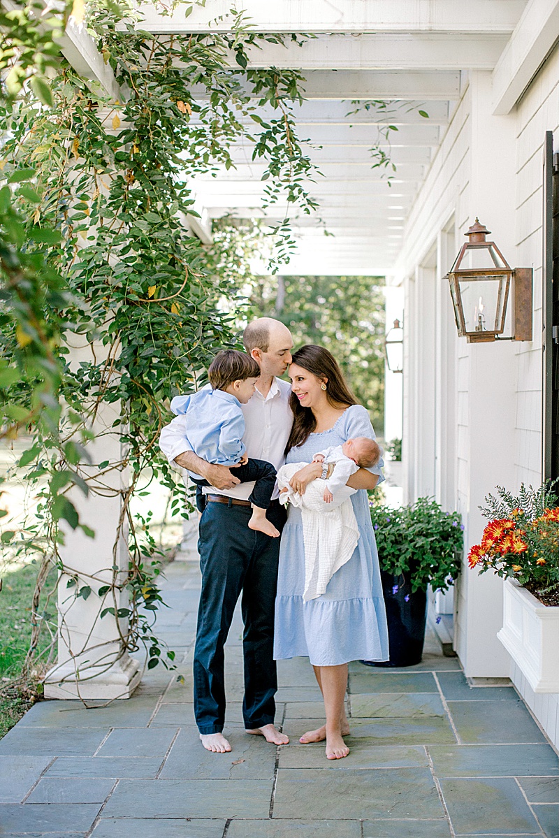 in home newborn photography session in Richmond Virginia family outside of home featured by the motherhood anthology