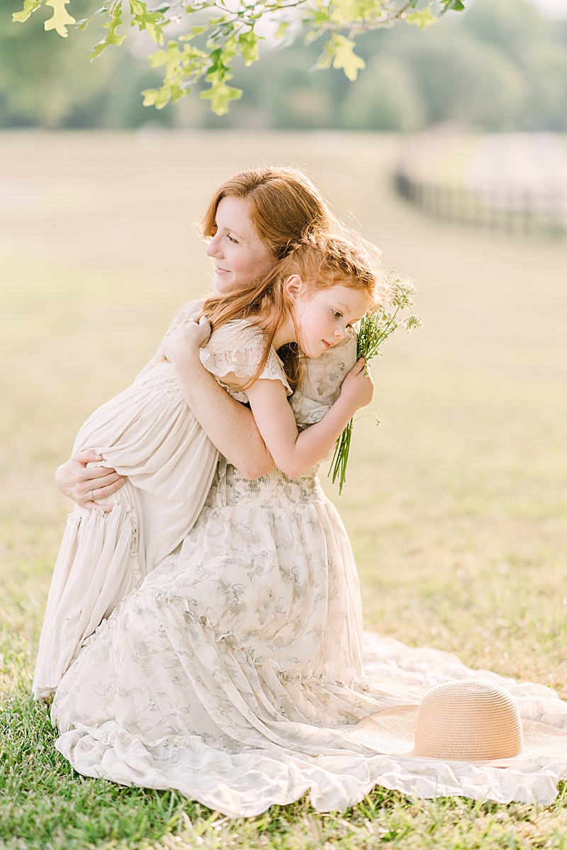 family photography session in Atlanta, Georgia featured by The Motherhood Anthology and photographed by Mary Ann Craddock Photography mom and daughter hugging