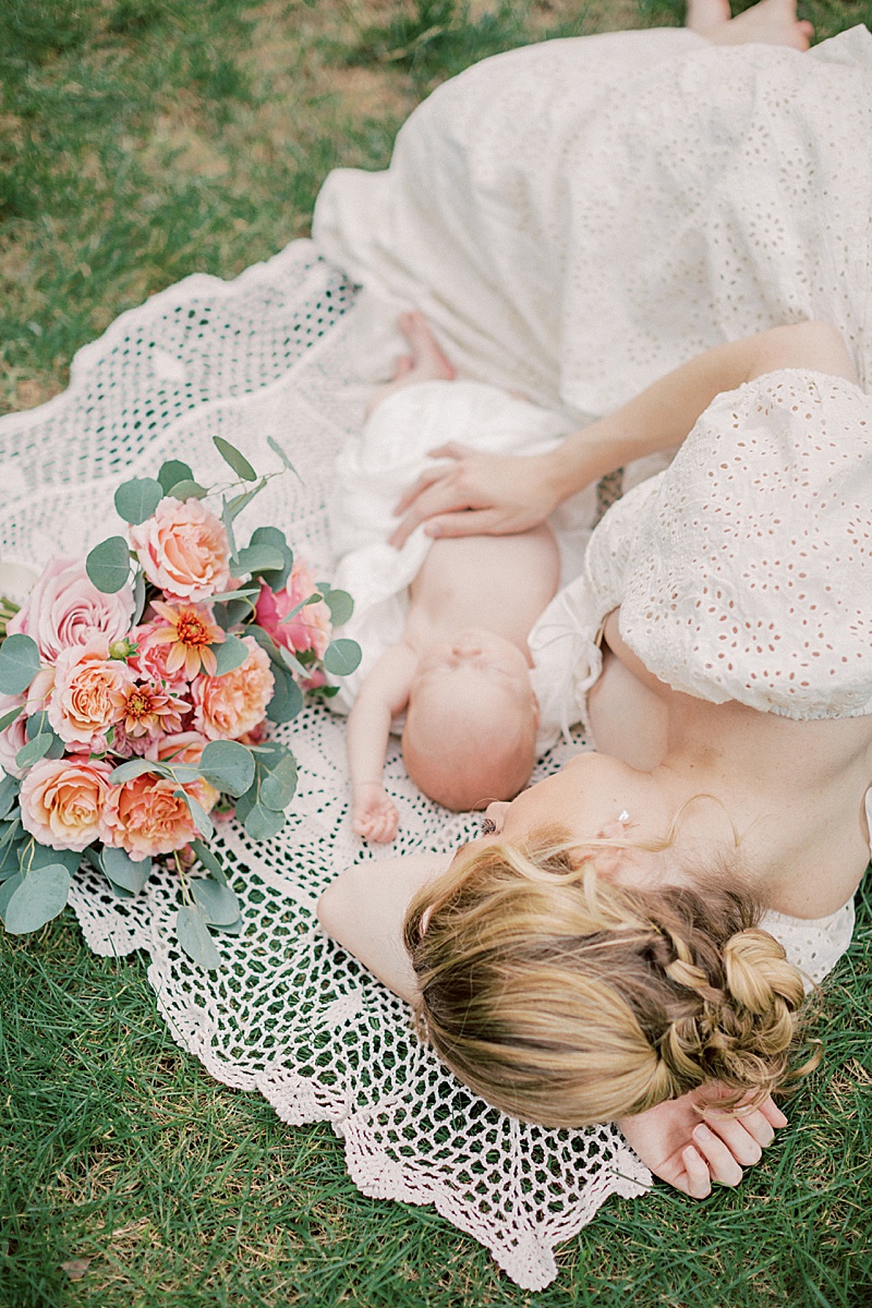 Marie-Elizabeth Photography highlight images featured on The Motherhood Anthology mama and newborn laying in the field