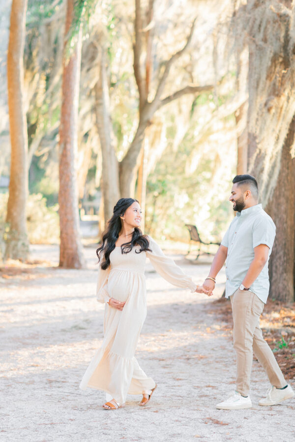 maternity photography session in outdoor field photographed by Rooted Love Photography in Orlando, FL featured on The Motherhood Anthology blog