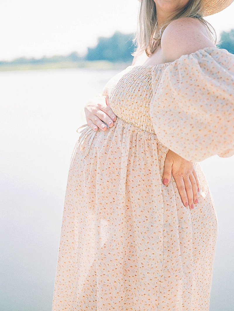 waterfront maternity session in Richmond, Virginia photographed by Beatific Visions Photography and featured on The Motherhood Anthology blog