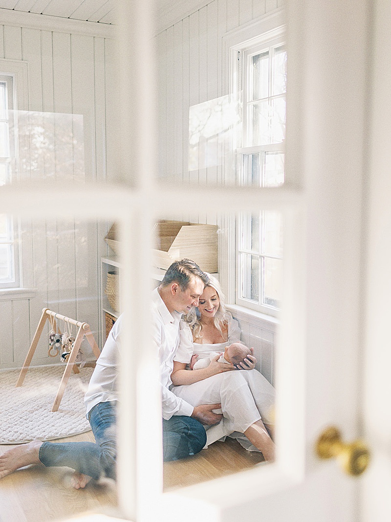 family newborn in home lifestyle session all white neutral photographed by Morgan Williams Photo in Raleigh, NC featured on The Motherhood Anthology blog