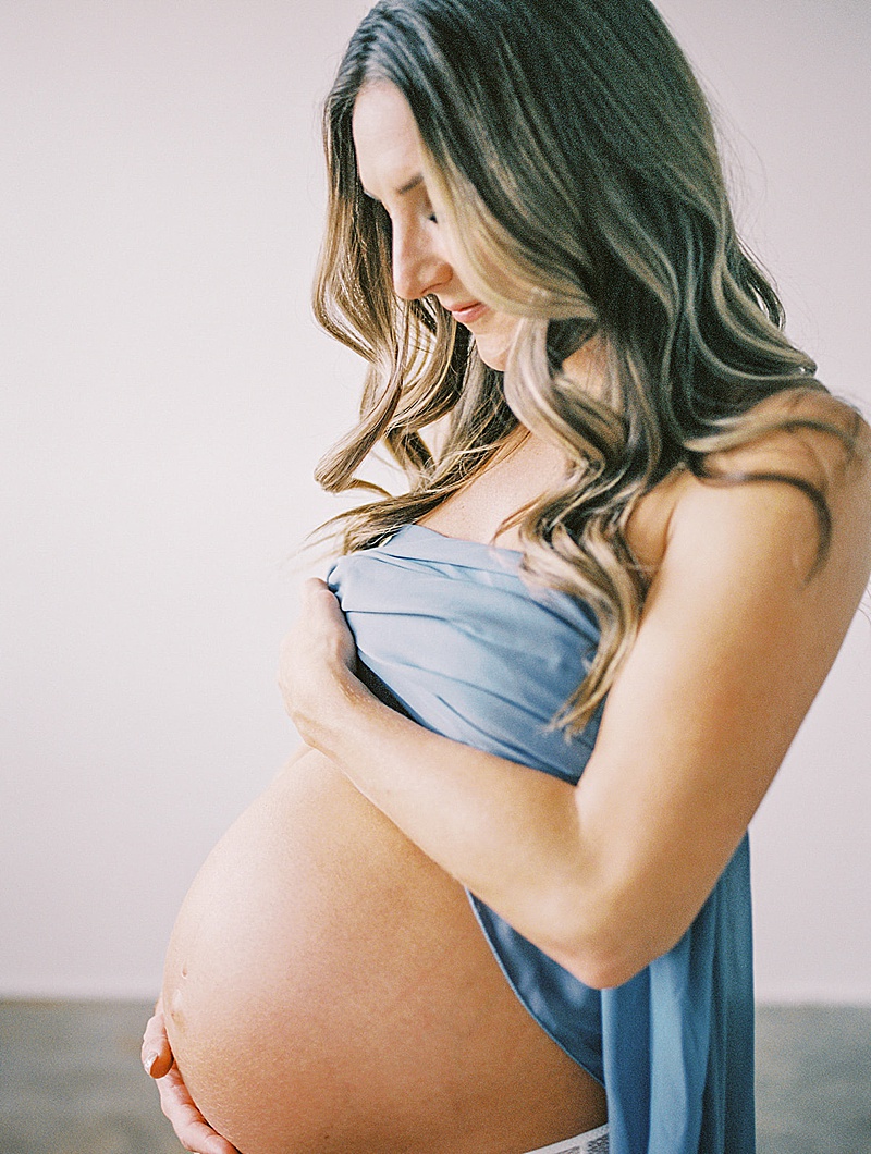 intimate studio maternity session in Denver, Colorado natural light photography by Crystal Leffel Photography featured on The Motherhood Anthology blog
