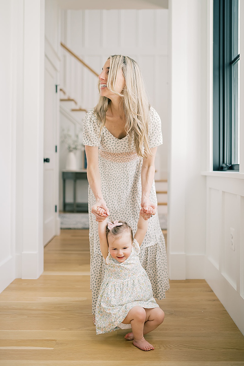 in-home lifestyle photography session emom and daughter in hallway natural light photography 