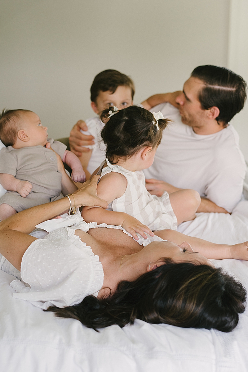 cozy in-home newborn session neutral tones family photography boca raton fl nkb photo featured on the motherhood anthology