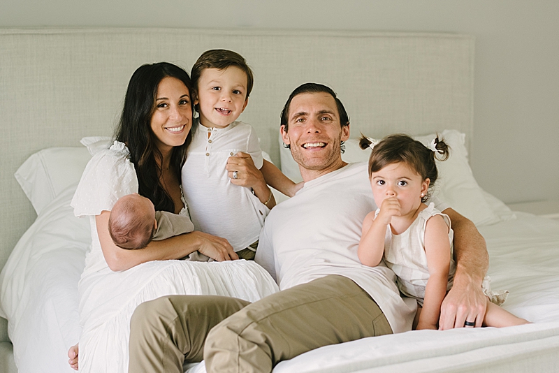 cozy in-home newborn session neutral tones family photography boca raton fl nkb photo featured on the motherhood anthology