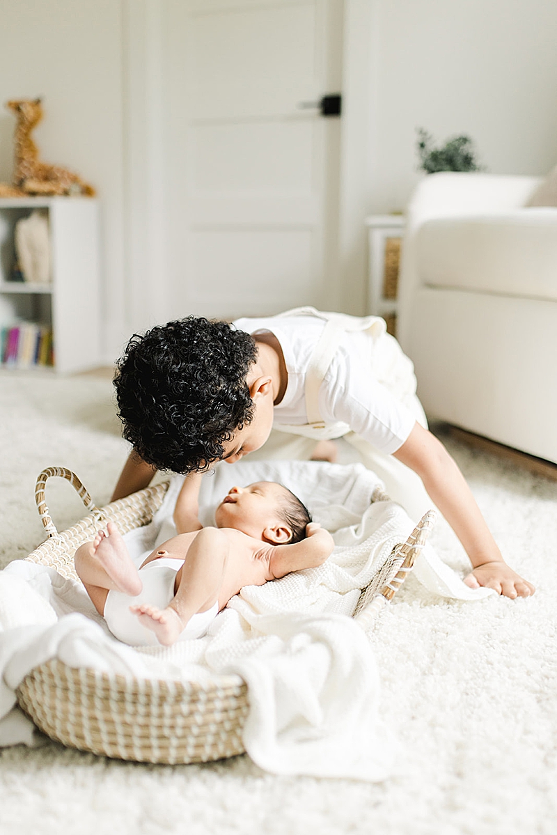 natural light photography in-home newborn photography session toddler with newborn 