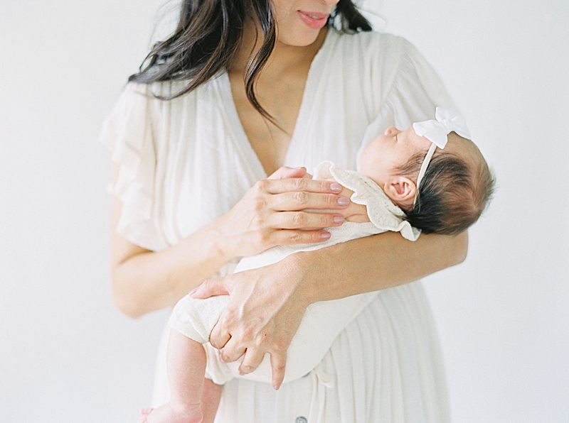 in studio newborn session natural light photography mommy and baby