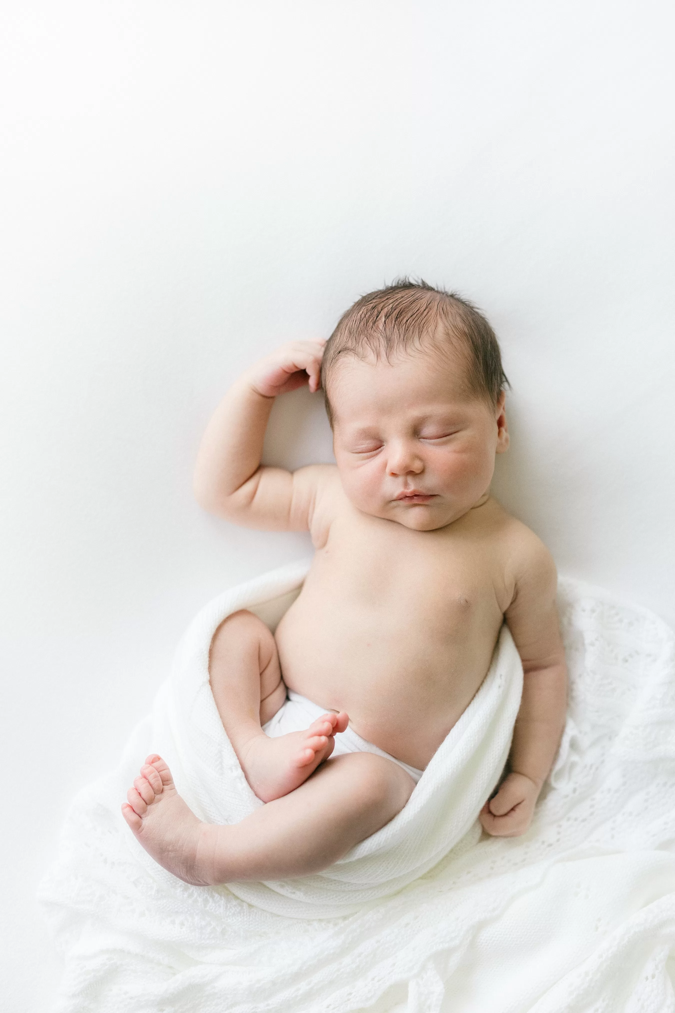 newborn image on a soft white background 